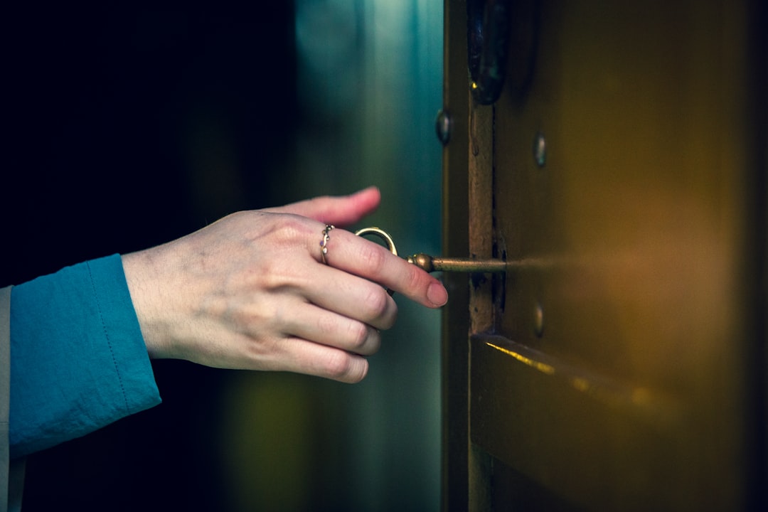 person holding key